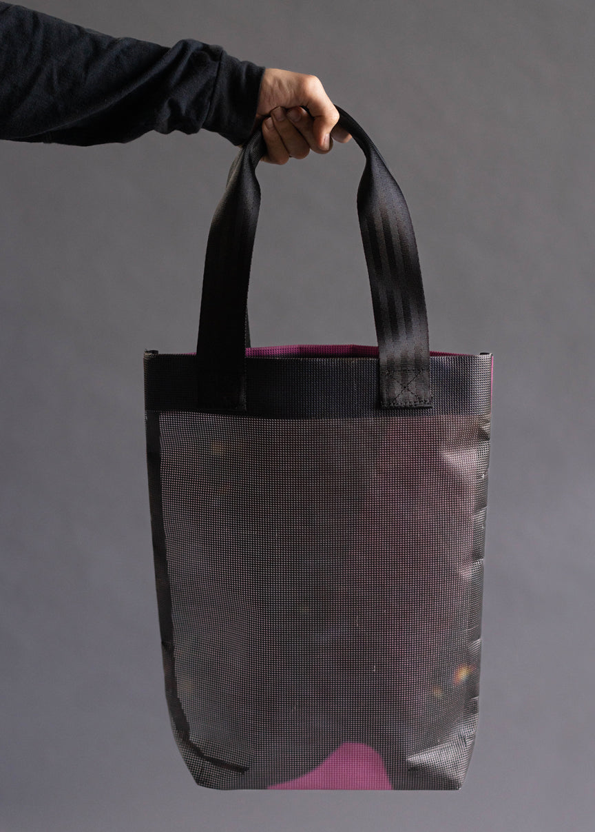 Tote bag, showing its back. No text or graphics are displayed on this particular view