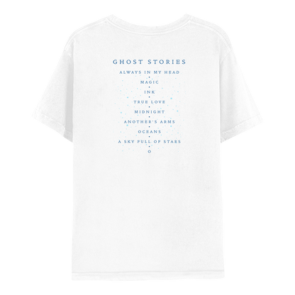 2: Back: the shirt is white. GHOST STORIES and track list printed in dark blue. Small light blue dots adorn the text, like scattered stars. Song titles are ALWAYS IN MY HEAD, MAGIC, INK, TRUE LOVE, MIDNIGHT, ANOTHER’S ARMS, OCEANS, A SKY FULL OF STARS, AND O