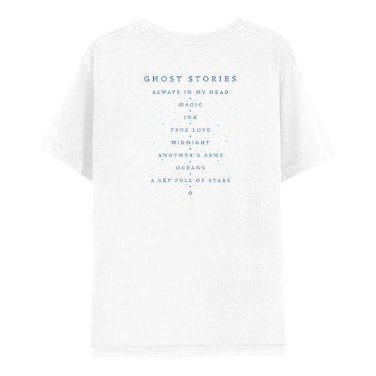2: Back: the shirt is white. GHOST STORIES and track list printed in dark blue. Small light blue dots adorn the text, like scattered stars. Song titles are ALWAYS IN MY HEAD, MAGIC, INK, TRUE LOVE, MIDNIGHT, ANOTHER’S ARMS, OCEANS, A SKY FULL OF STARS, AND O