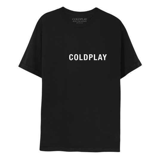 Front: COLDPLAY is printed in large, white, uppercase font, across the chest of a black T-shirt. On the label of the neckline is printed COLDPLAY, MUSIC OF THE SPHERES, 100% COTTON