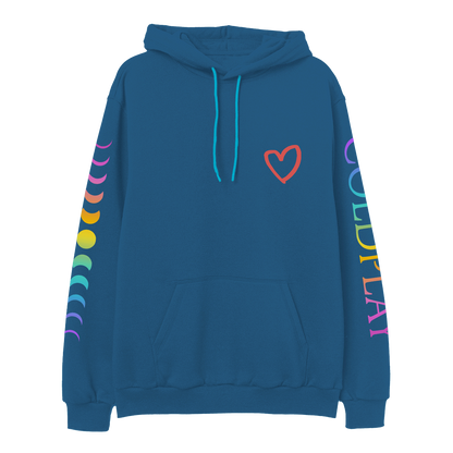 Front: A red hand-drawn heart is printed on the chest of a blue hoodie with front pocket and light blue hoodie string. COLDPLAY is printed vertically on left sleeve. C is purple, O light blue, L is green, D green to yellow, P is orange, L dark orange, A pink, Y is fuchsia. An 11-phase lunar cycle is printed vertically on the right sleeve. The moons are fuchsia, orange, yellow, green, blue and lilac.