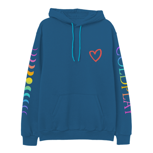 Front: A red hand-drawn heart is printed on the chest of a blue hoodie with front pocket and light blue hoodie string. COLDPLAY is printed vertically on left sleeve. C is purple, O light blue, L is green, D green to yellow, P is orange, L dark orange, A pink, Y is fuchsia. An 11-phase lunar cycle is printed vertically on the right sleeve. The moons are fuchsia, orange, yellow, green, blue and lilac.