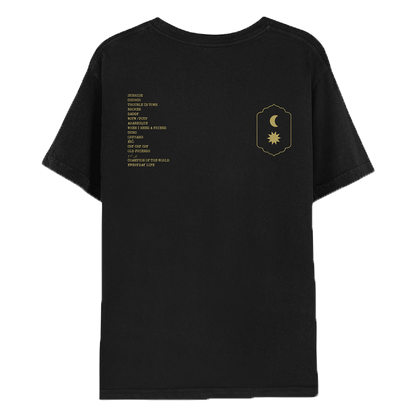 2: Back: With the album track list on the left, the moon and the sun on the right. Both text and symbols are golden. Songs are Sunrise, Church, Trouble in Town, BrokEn, Daddy, WOTW/POTP, Arabesque, When I Need a Friend, Guns, Orphans, Èkó, Cry Cry Cry, Old Friends, Bani Adam, Champion of the World, and Everyday Life