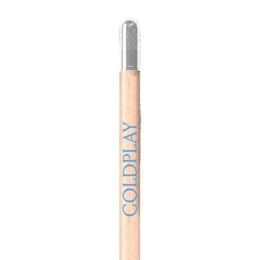 Close up of 1 wooden pencil: COLDPLAY is printed in light blue along its length. It has a natural light brown wood color, and a clear capsule attached to its end, which contains the seeds. These capsules are cylindrical and made of thin biodegradable material that would feel different to the touch compared to the texture of the wood. The attachment is designed to keep the capsule in place until the pencil is used up, and the seeds can be planted.