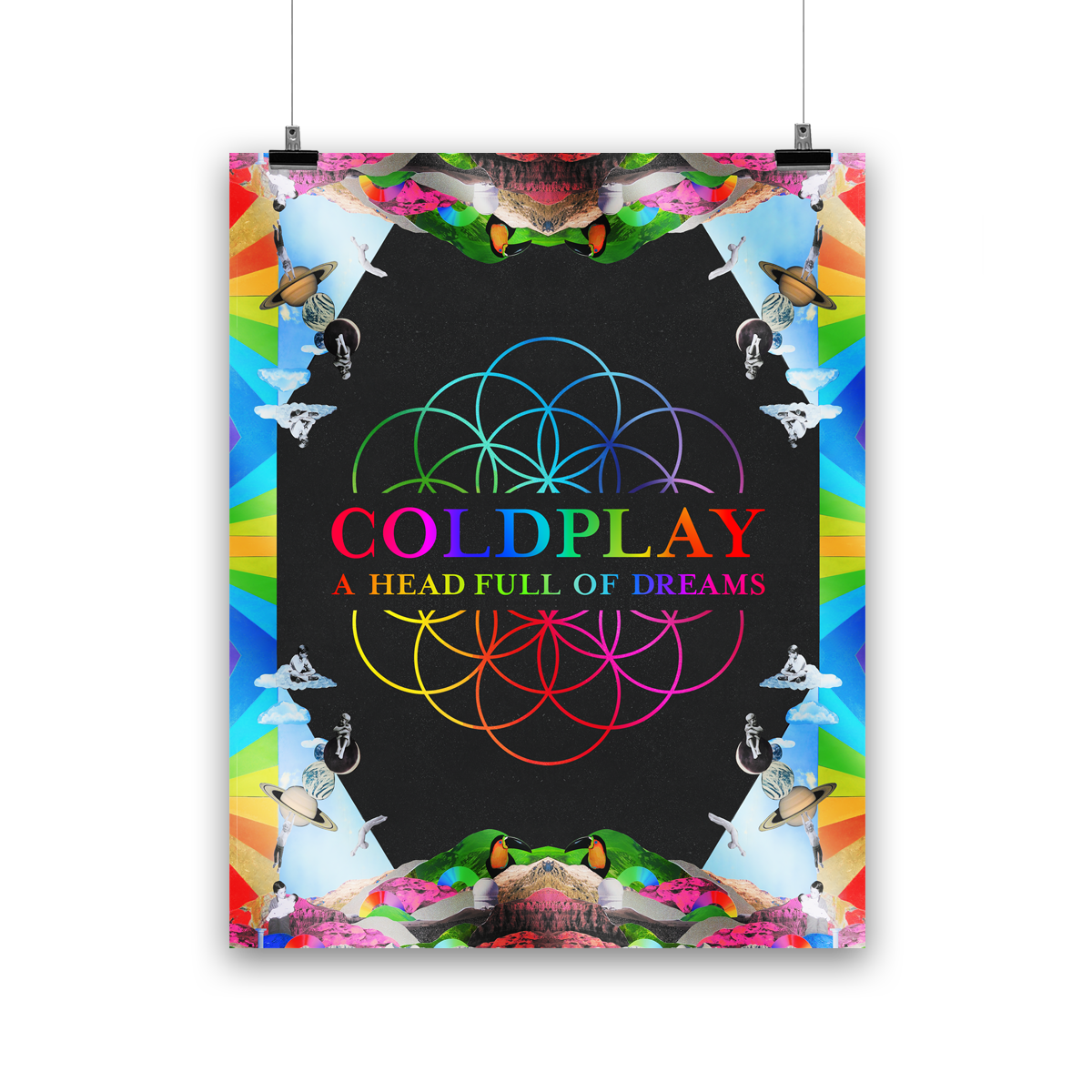 Image 1:
The poster features the flowerOfLife in the center, with intertwined circles as blue, green, yellow, orange, pink&purple petals; the band appear as kids: Phil sits on a white fluffy??Chris sits on the moon, Jonny hangs from Saturn’s rings, Will jumps into a swimming pool, and Guy holds his baby brother. Mirrored mountains grace the edges. There are planets, astronauts, rainbow stripes,& a toucan with a bright yellow chest, black head&beak, and an orange face. The illustrations form a kaleidoscope