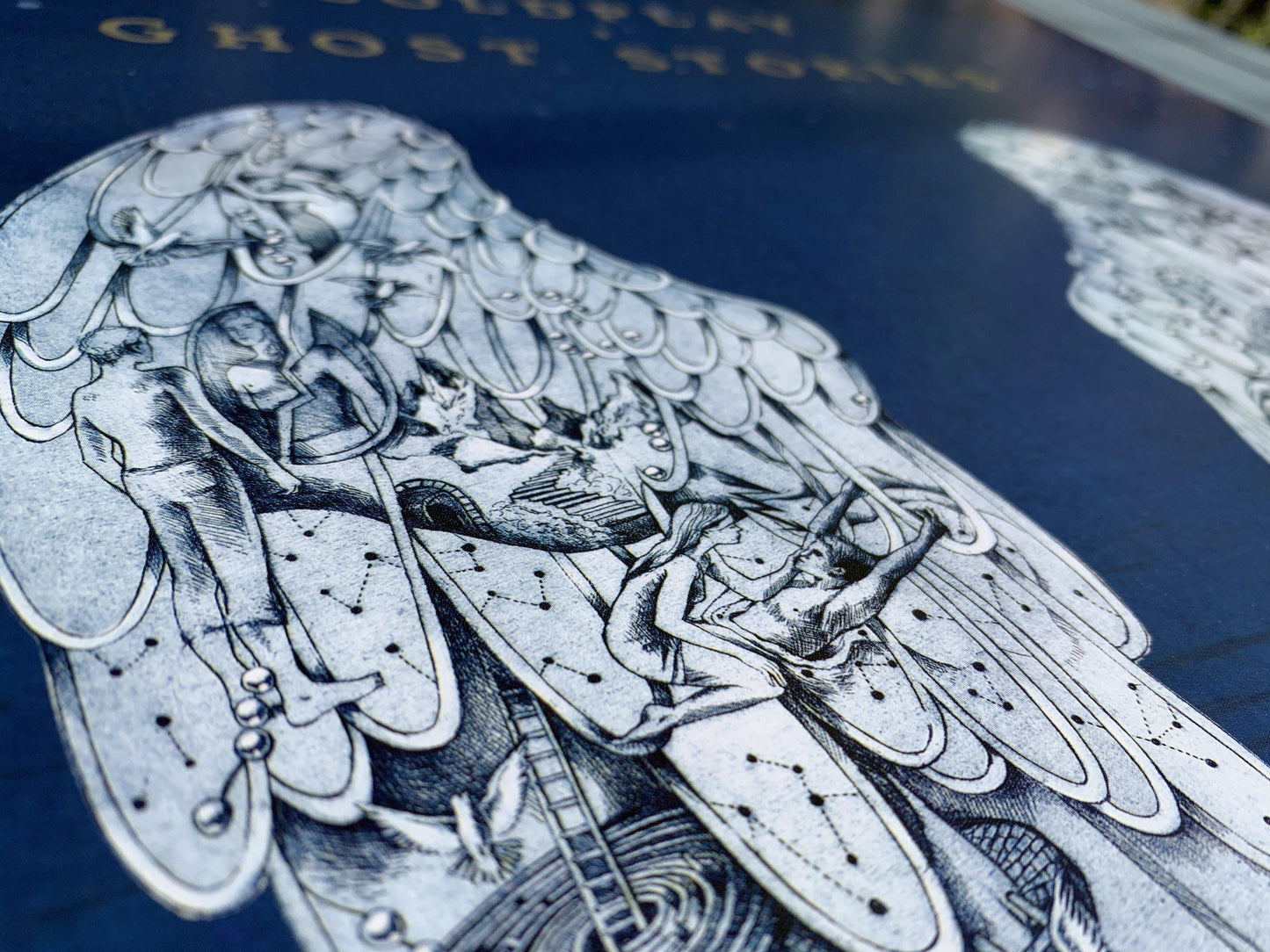 Cont: GirlSittingOnStaircase SeesStormThrough a??&turnsOn aLamp. BirdsForm a silhouetteOf aManLookingDown; 3whitePigeons flyOverhead. A???StairsGoDownTo a trainTunnel. A labyrinthWithStairs leadsTo a metallicSphere, likeSaturn, surroundedBy rings. EachRing has aLyric: TellMeYouLoveMe. SecretNobodyKnows. NoOneEverHears. WaitForYourCall, love. MeetMeAgain. InTheRain. TheyFlyOn. LookUpToTheSky. On a doorframe, branchesGrowFrom an??a brickWall has anOpen??to aRoomWith a??signpostIndicates thousandsOfMiles