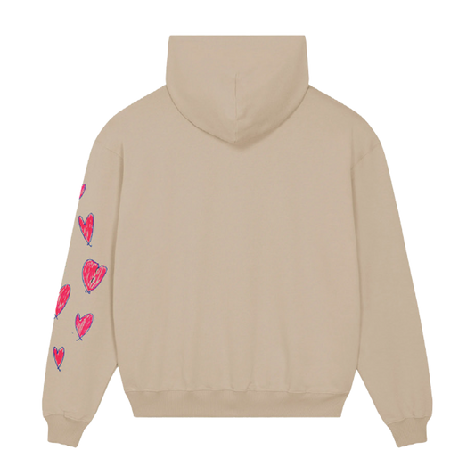 Back: This view shows the solid light beige fabric of the hoodie, and the pink fuchsia hearts outlined in purple on the left sleeve. We can also see its hood.