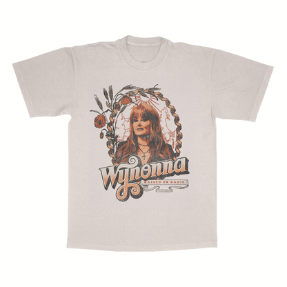 Classic fitting unisex tee in natural featuring a Wynonna Judd photo and Raised On Radio design printed on the front.