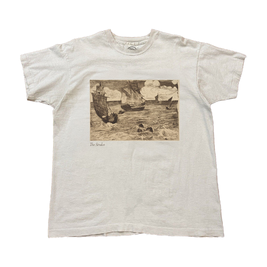 White t-shirt with a vintage-style graphic of ships on water in between waves. A small The Stokes text is written underneath the image on the lower left. 