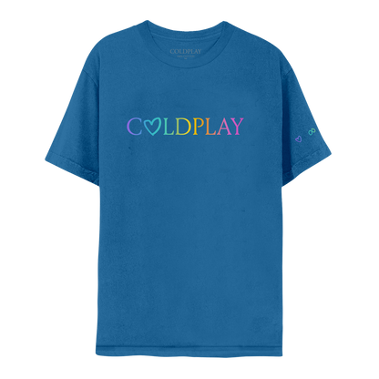 Front: COLDPLAY written on chest in a color gradient. A hand-drawn heart makes the letter O; C is purple, O is light blue, L is green, D green to yellow, P is orange, L is dark orange, A is pink, Y is fuchsia. A purple heart, green infinity sign, orange circle and pink rainbow adorn the left sleeve. The shirt is blue.